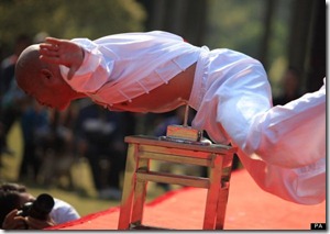li xin balancing_head_on_nail