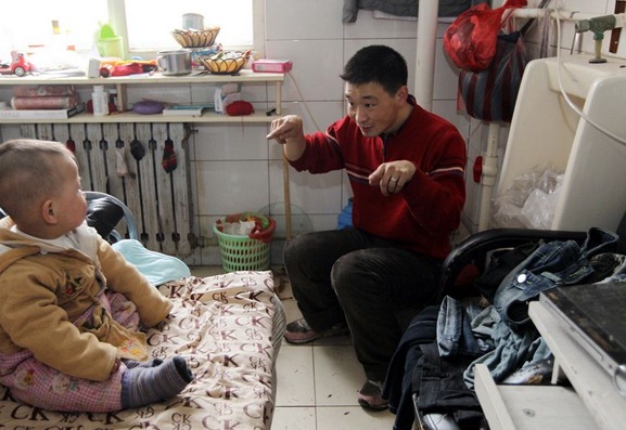 Chinese family of 3 lives in transformed public restroom